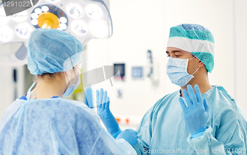 Image of surgeons in operating room at hospital