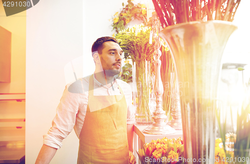 Image of florist man or seller at flower shop