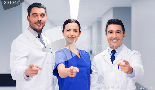 Image of group of medics pointing finger on you at hospital