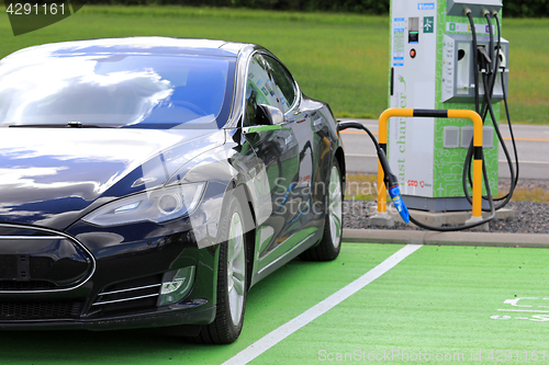 Image of Black Tesla Model S Electric Car Charging