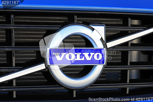 Image of Sign Volvo on New Blue Car