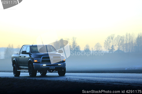 Image of Dodge Pickup Truck on Foggy Sunset Road