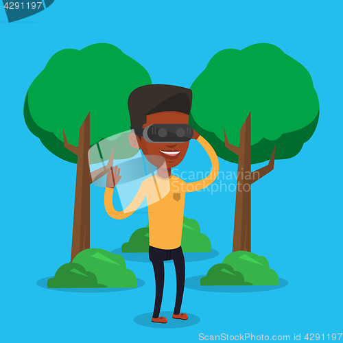 Image of Man wearing virtual reality headset in the park.