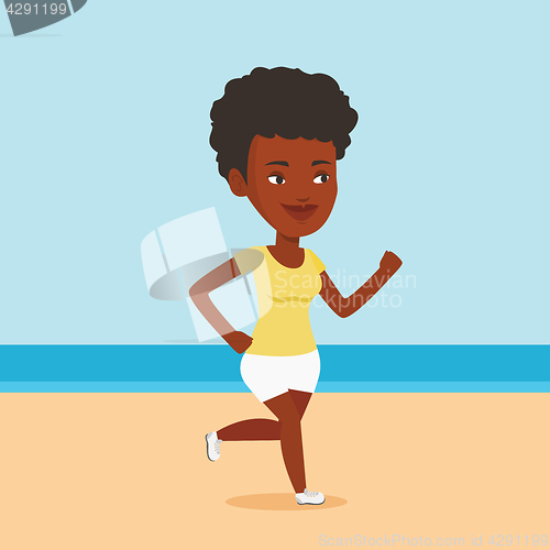 Image of Young sporty woman jogging on the beach.