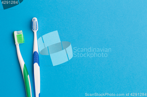 Image of Colorful toothbrushes , place for inscription
