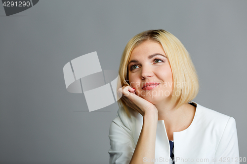 Image of Girl with hand under chin