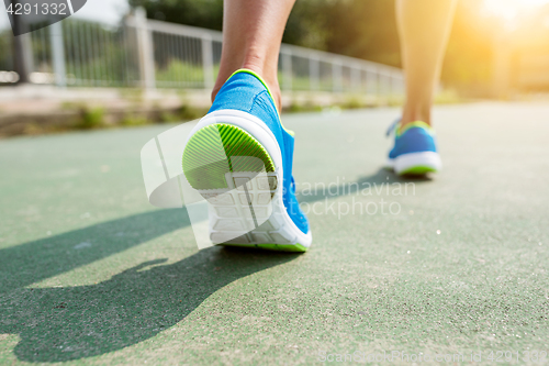 Image of Woman training to run in a city