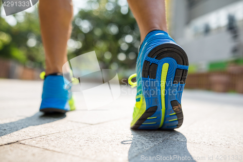 Image of Man running in a park