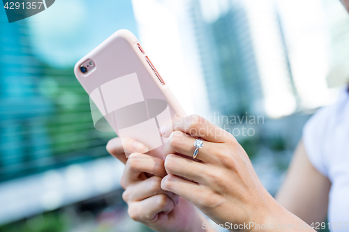 Image of Woman using mobile phone