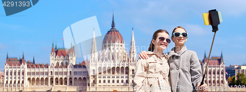 Image of girls with smartphone selfie stick in budapest