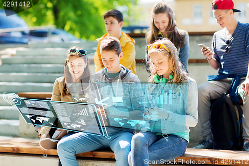 Image of happy teenage friends with smartphones outdoors