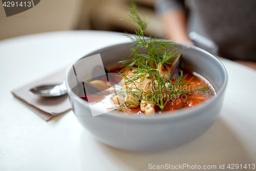 Image of seafood soup with fish and blue mussels in bowl