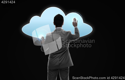 Image of businessman working with virtual cloud projection