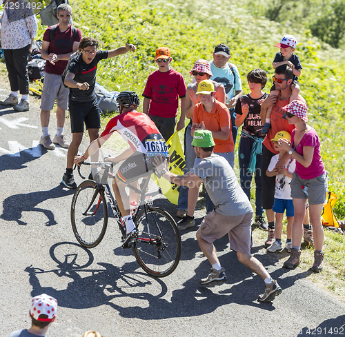 Image of Spectator Pushing a Cyclist - Tour de France 2016