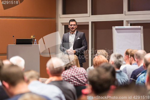 Image of Business speaker giving a talk at conference meeting.