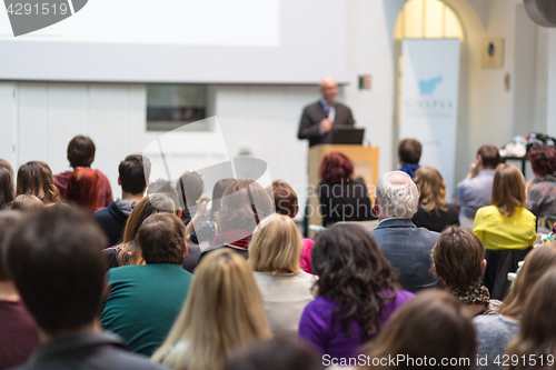 Image of Man giving presentation in lecture hall at university.