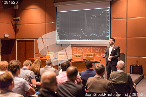 Image of Business speaker giving a talk at business conference event.