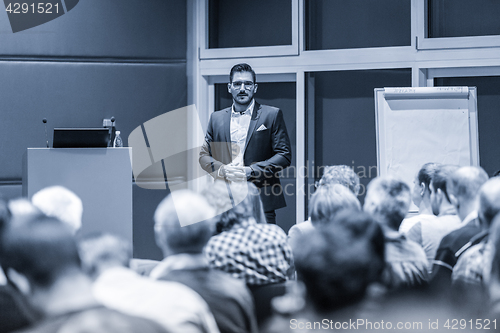 Image of Business speaker giving a talk at conference meeting.