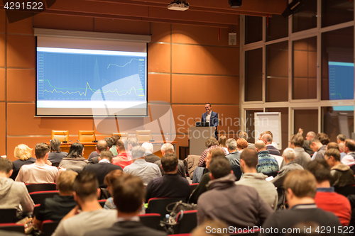 Image of Business speaker giving a talk at business conference event.