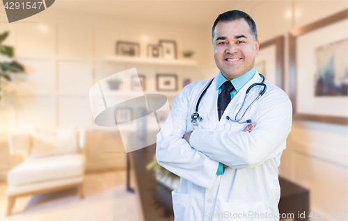 Image of Handsome Hispanic Doctor or Nurse Standing in His Office
