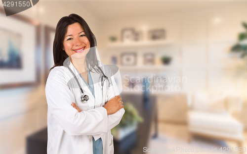 Image of Female Hispanic Doctor or Nurse Standing in Her Office