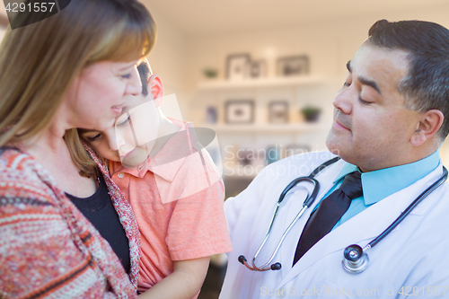 Image of Young Sick Boy and Mother Visiting with Hispanic Doctor in Offic