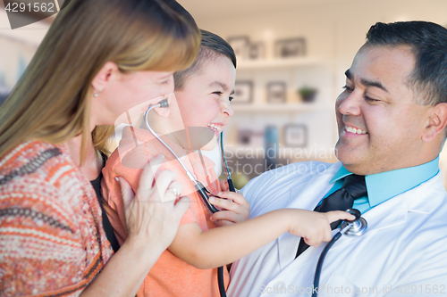 Image of Young Boy and Mother Visiting with Hispanic Doctor in Office