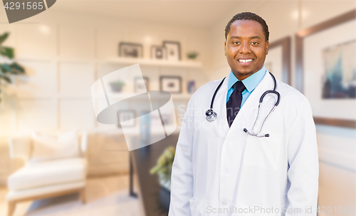 Image of Young African American Doctor or Nurse Standing in His Office