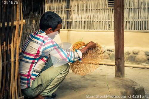 Image of Weaving man in Nepal