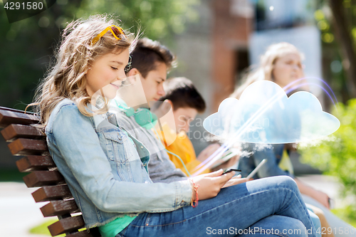 Image of happy girl with tablet pc computer outdoors