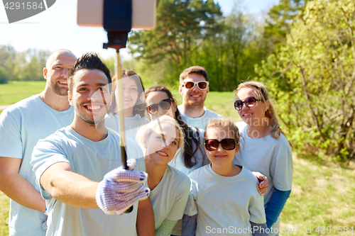 Image of group of volunteers taking smartphone selfie