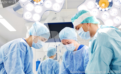 Image of group of surgeons in operating room at hospital