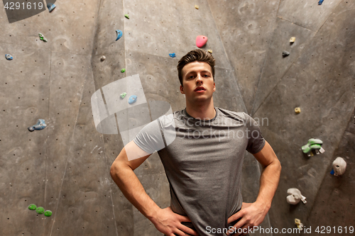 Image of young man exercising at indoor climbing gym