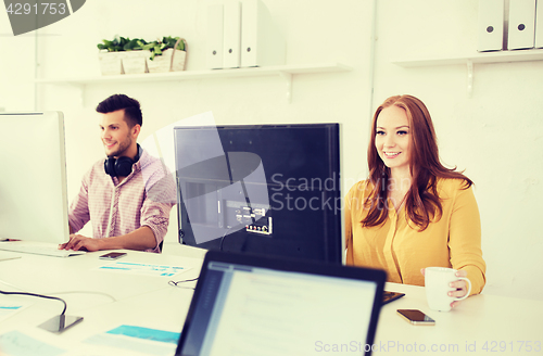 Image of creative team with computers working at office