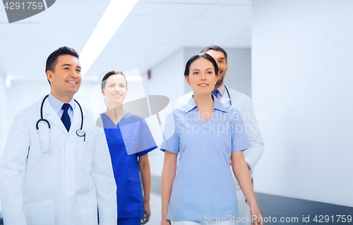Image of happy group of medics or doctors at hospital
