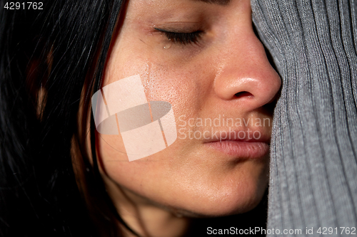 Image of close up of unhappy crying woman