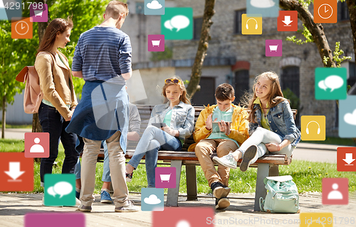 Image of teenage students with tablet pc at school yard