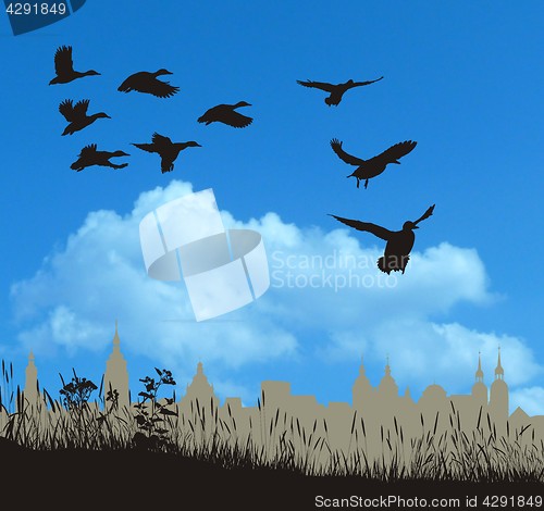 Image of Flock of crows over white tree