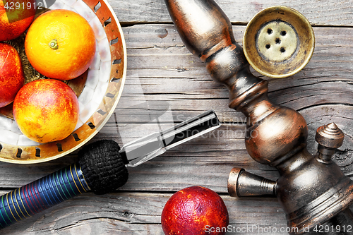 Image of oriental hookah with orange taste