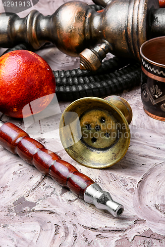 Image of oriental hookah with orange taste