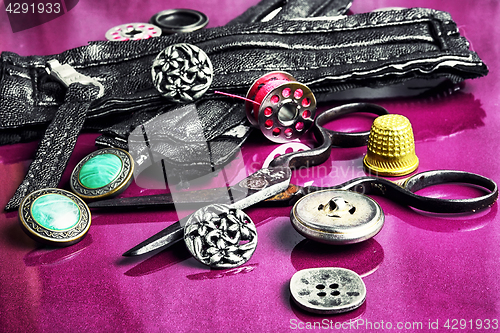Image of Sewing accessories on purple background