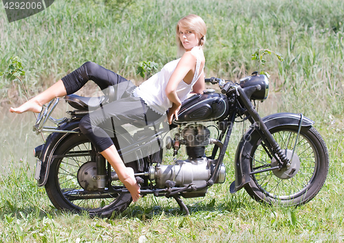 Image of Young woman on motorcycle