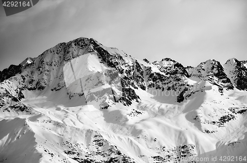 Image of Black and white view on snow sunlight mountain and gray sky in e