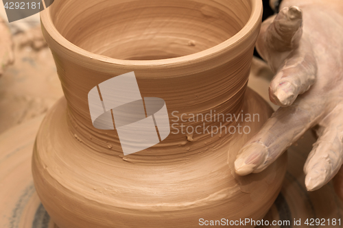 Image of Process of making crockery on a potter\'s wheel