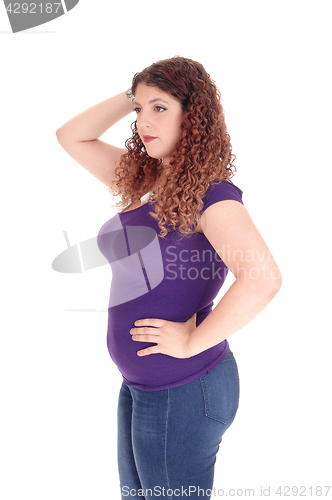 Image of Curvy woman standing in profile.
