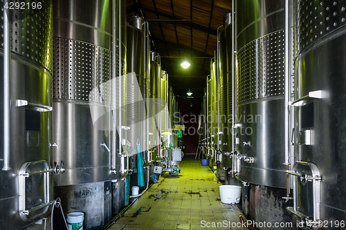 Image of metal wine barrels in a winery