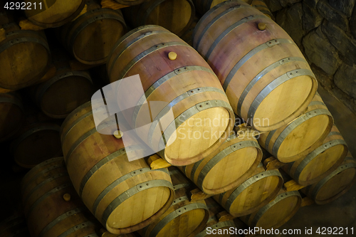 Image of wood wine barrels in a winery