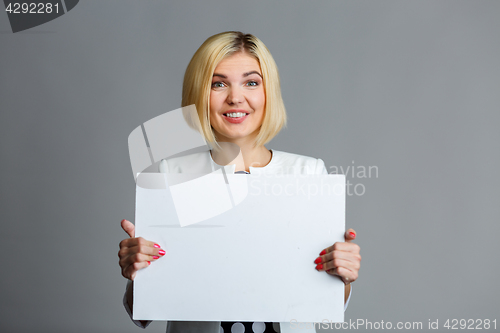 Image of Photo of girl with paper