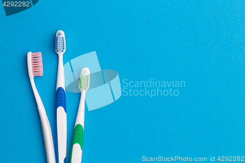 Image of Colorful toothbrushes, place for inscription