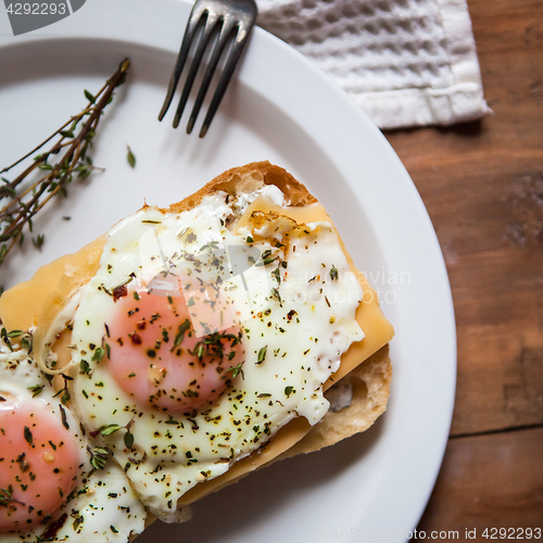 Image of Scrambled eggs with cheese on bread, close up view